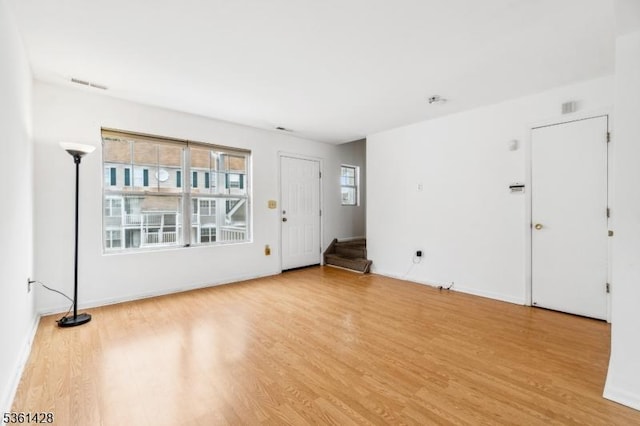 239 40th St Unit 7, Irvington Twp, NJ 07111 - spare room featuring light wood-style floors, baseboards, and stairs