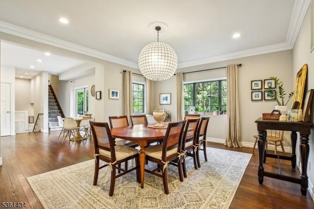 100 Gregory Ave, West Orange Twp, NJ 07052 - dining space with stairs, dark wood-type flooring, a chandelier, ornamental molding, and baseboards