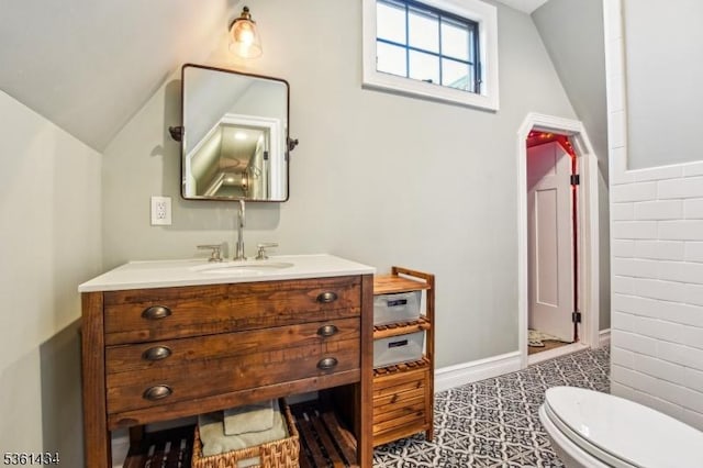 100 Gregory Ave, West Orange Twp, NJ 07052 - bathroom featuring vaulted ceiling, vanity, toilet, and baseboards
