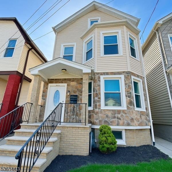 276 5th Ave, Paterson City, NJ 07524 - view of front of home with stone siding