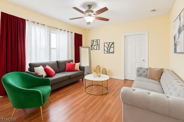 276 5th Ave, Paterson City, NJ 07524 - living room with wood finished floors, a ceiling fan, and baseboards