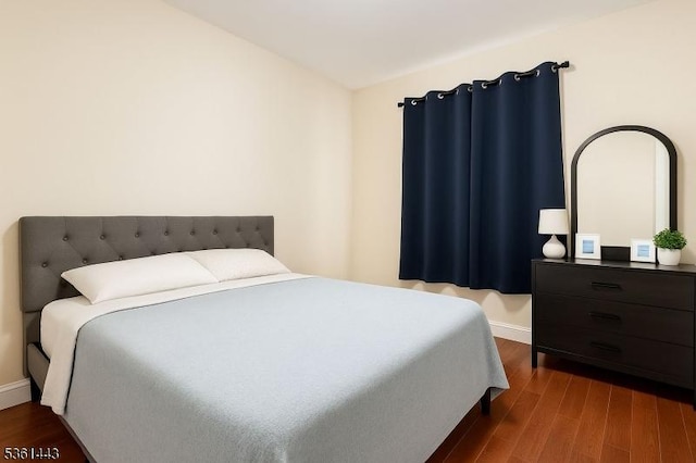 276 5th Ave, Paterson City, NJ 07524 - bedroom featuring dark wood finished floors and baseboards