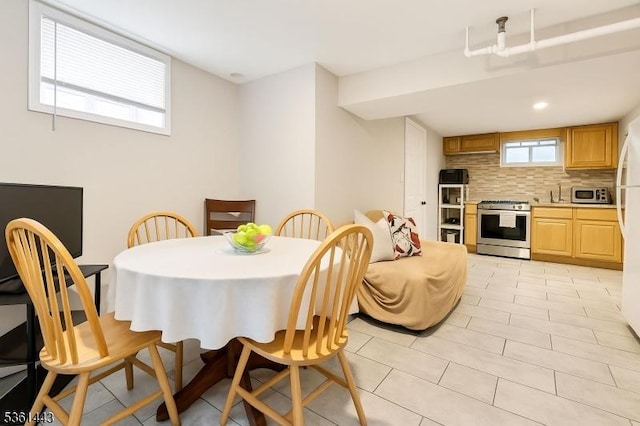 276 5th Ave, Paterson City, NJ 07524 - dining area with light tile patterned floors