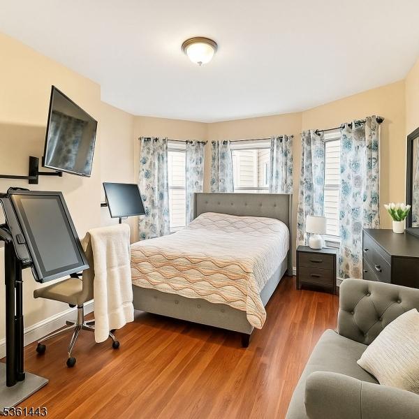 276 5th Ave, Paterson City, NJ 07524 - bedroom featuring wood finished floors and baseboards