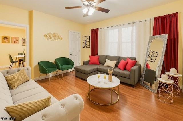 276 5th Ave, Paterson City, NJ 07524 - living area with wood finished floors, ceiling fan, and baseboards