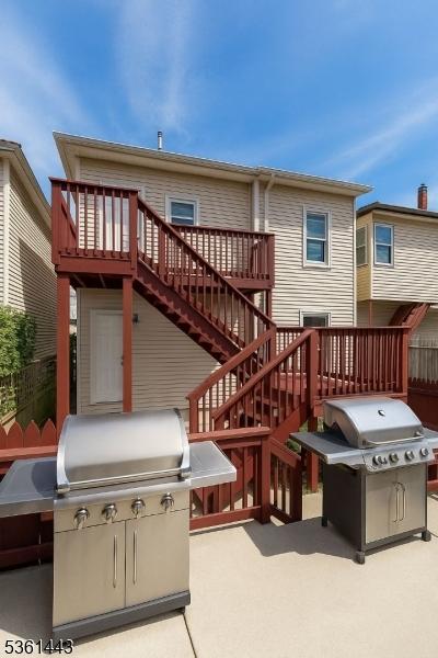 276 5th Ave, Paterson City, NJ 07524 - rear view of property with a patio, a deck, and stairway