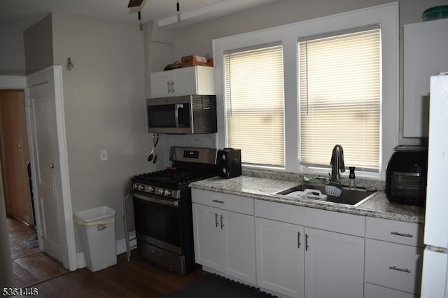 375 Tower St, Union Twp, NJ 07088 - kitchen with appliances with stainless steel finishes, a sink, white cabinetry, wood finished floors, and ceiling fan