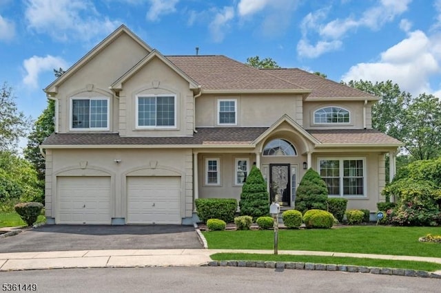 9 Mcgovern Ct, Bridgewater Twp, NJ 08807 - traditional-style home featuring stucco siding, asphalt driveway, an attached garage, and a front lawn