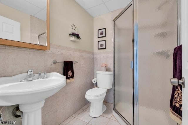 9 Mcgovern Ct, Bridgewater Twp, NJ 08807 - bathroom with a stall shower, tile walls, tile patterned floors, and a drop ceiling