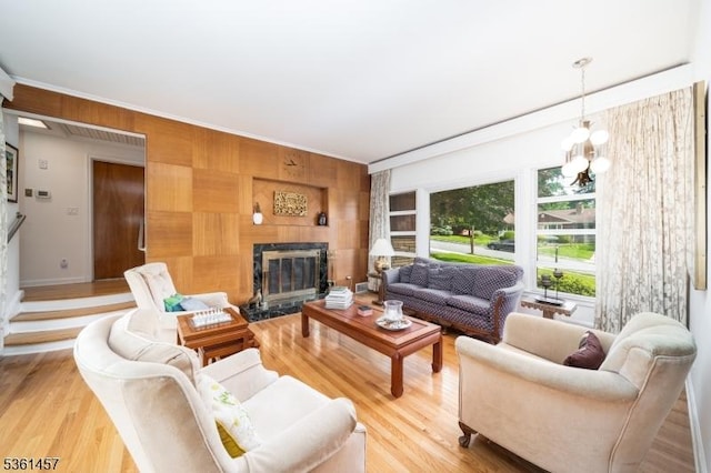 32 Fairway Ave, West Orange Twp, NJ 07052 - living room with a high end fireplace, light wood finished floors, wooden walls, baseboards, and ornamental molding