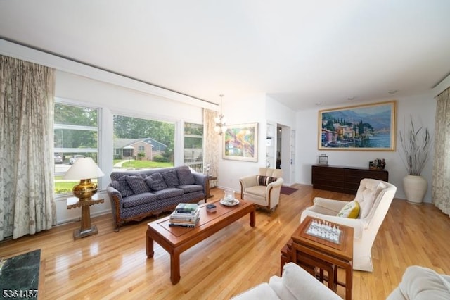 32 Fairway Ave, West Orange Twp, NJ 07052 - living area with light wood-style flooring and a chandelier