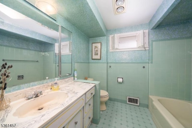 32 Fairway Ave, West Orange Twp, NJ 07052 - full bath with toilet, vanity, tile patterned floors, a tub to relax in, and wainscoting