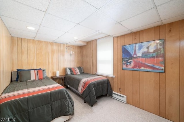 32 Fairway Ave, West Orange Twp, NJ 07052 - bedroom with baseboard heating, carpet flooring, wooden walls, and a paneled ceiling
