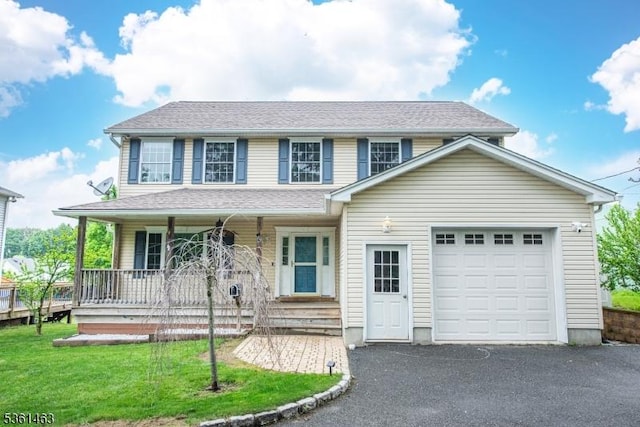 5 Britton St, Netcong Boro, NJ 07857 - view of front of house featuring covered porch, a garage, driveway, and a front lawn