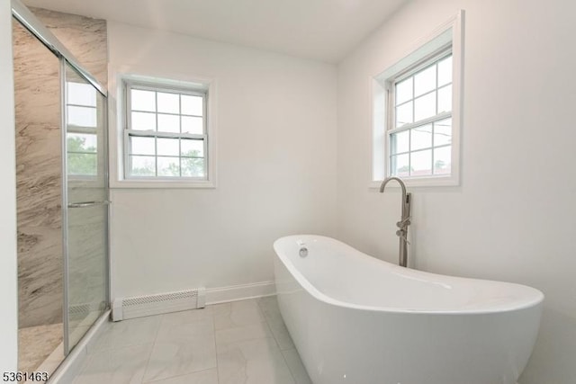 5 Britton St, Netcong Boro, NJ 07857 - full bathroom featuring a soaking tub, a shower stall, marble look tile flooring, and baseboards