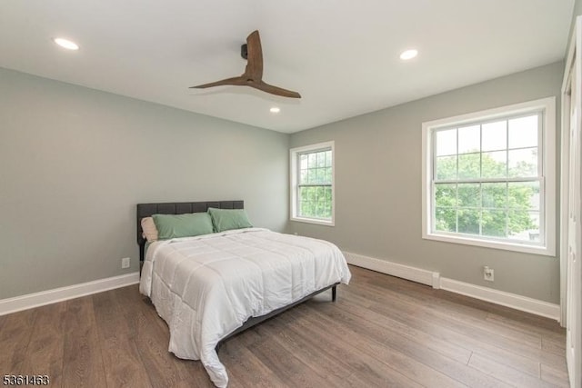5 Britton St, Netcong Boro, NJ 07857 - bedroom with baseboard heating, wood finished floors, baseboards, and recessed lighting