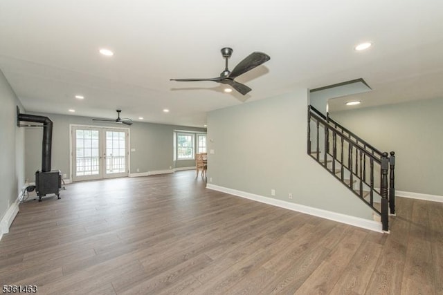 5 Britton St, Netcong Boro, NJ 07857 - unfurnished living room featuring ceiling fan, a wood stove, recessed lighting, wood finished floors, and baseboards