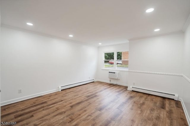 16 Deanna Dr Unit 23, Hillsborough Twp, NJ 08844 - empty room with baseboard heating, recessed lighting, a wall mounted AC, wood finished floors, and baseboards