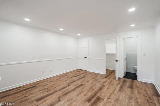 16 Deanna Dr Unit 23, Hillsborough Twp, NJ 08844 - unfurnished bedroom with wood finished floors, recessed lighting, a spacious closet, baseboards, and a closet