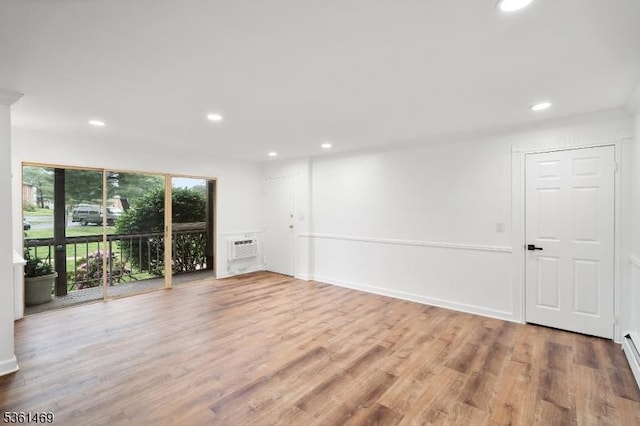 16 Deanna Dr Unit 23, Hillsborough Twp, NJ 08844 - unfurnished room featuring wood finished floors, recessed lighting, an AC wall unit, and baseboard heating