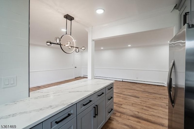 16 Deanna Dr Unit 23, Hillsborough Twp, NJ 08844 - kitchen featuring freestanding refrigerator, wood finished floors, gray cabinets, light stone countertops, and decorative light fixtures