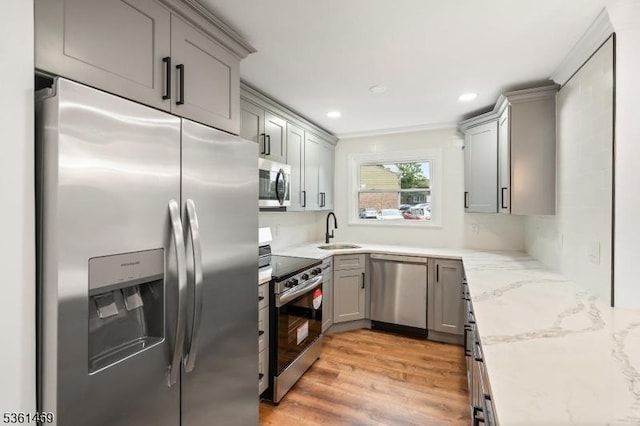 16 Deanna Dr Unit 23, Hillsborough Twp, NJ 08844 - kitchen with stainless steel appliances, gray cabinets, a sink, light wood-style flooring, and recessed lighting