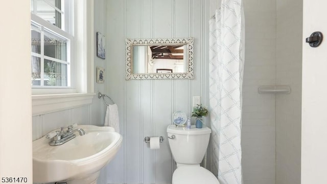 23 Laurel Pl, Fanwood Boro, NJ 07023 - bathroom featuring a sink, a decorative wall, toilet, and curtained shower