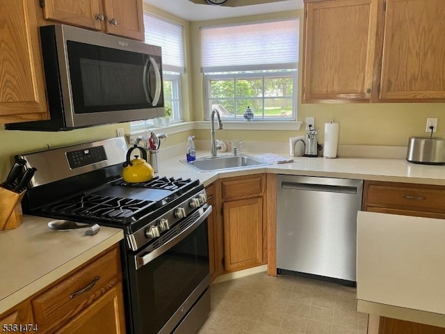 111 Crenshaw Dr, Mount Olive Twp, NJ 07836 - kitchen featuring stainless steel appliances, light countertops, and brown cabinets