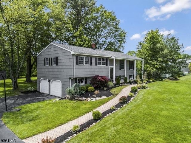 1730 Arrowbrook Dr, Bridgewater Twp, NJ 08836 - split foyer home featuring driveway, an attached garage, a front lawn, and a chimney