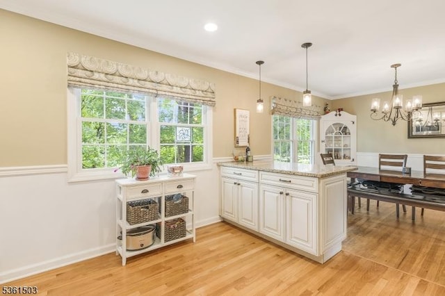 1730 Arrowbrook Dr, Bridgewater Twp, NJ 08836 - kitchen with light wood finished floors, white cabinets, a chandelier, a peninsula, and crown molding