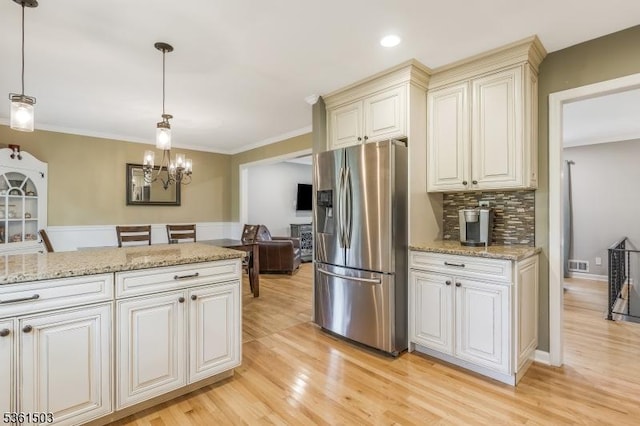 1730 Arrowbrook Dr, Bridgewater Twp, NJ 08836 - kitchen with stainless steel fridge, light wood-type flooring, a chandelier, ornamental molding, and tasteful backsplash