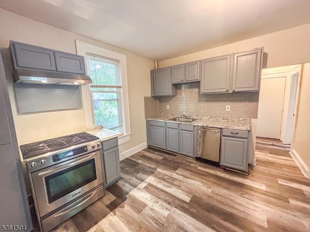 80 Western Ave, Morristown Town, NJ 07960 - kitchen with gray cabinetry, appliances with stainless steel finishes, wood finished floors, backsplash, and baseboards