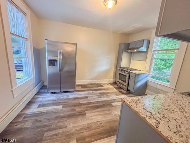 80 Western Ave, Morristown Town, NJ 07960 - kitchen featuring appliances with stainless steel finishes, gray cabinets, a baseboard heating unit, and wood finished floors