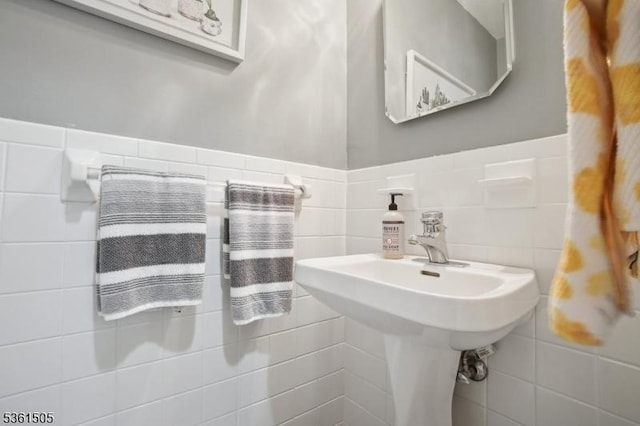 52 Hawthorne Ave, Springfield Twp, NJ 07081 - half bathroom featuring tile walls, a wainscoted wall, and a sink