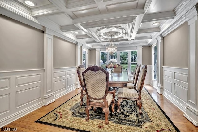 140 Lambertville Hopewell Rd, East Amwell Twp, NJ 08525 - dining area with decorative columns, coffered ceiling, a chandelier, a decorative wall, and crown molding