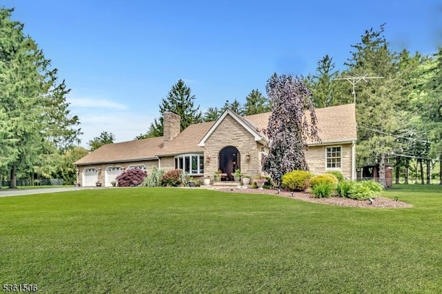 140 Lambertville Hopewell Rd, East Amwell Twp, NJ 08525 - view of front of house featuring a chimney, an attached garage, a front lawn, stone siding, and driveway