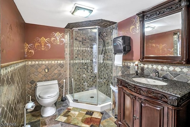 140 Lambertville Hopewell Rd, East Amwell Twp, NJ 08525 - bathroom featuring tile walls, toilet, a stall shower, vanity, and wainscoting