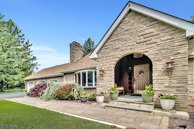 140 Lambertville Hopewell Rd, East Amwell Twp, NJ 08525 - view of front of house featuring stone siding, a chimney, and an attached garage