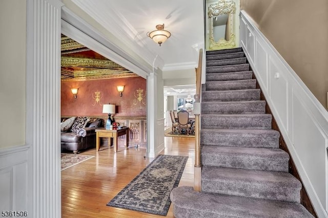 140 Lambertville Hopewell Rd, East Amwell Twp, NJ 08525 - staircase with a decorative wall, ornamental molding, hardwood / wood-style flooring, and wainscoting