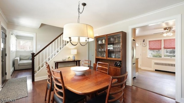 2052 Church Ave, Scotch Plains Twp, NJ 07076 - dining room featuring radiator heating unit, stairway, dark wood-style floors, ceiling fan, and crown molding