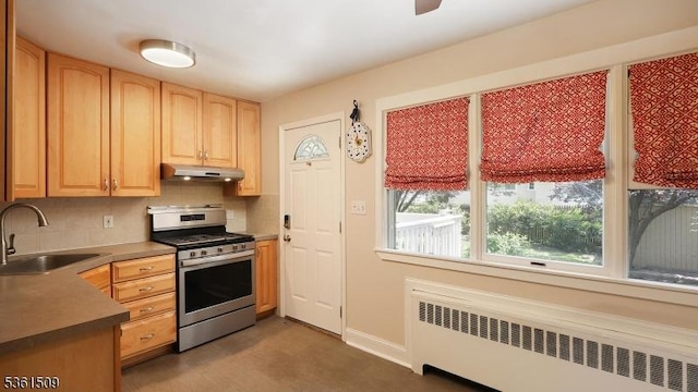 2052 Church Ave, Scotch Plains Twp, NJ 07076 - kitchen featuring gas range, radiator, a sink, under cabinet range hood, and backsplash