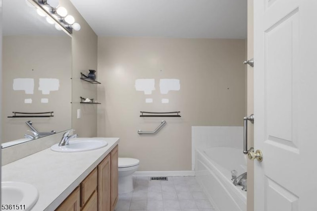 5 Caleb Ct, Hardyston Twp, NJ 07419 - full bath featuring tile patterned flooring, baseboards, double vanity, a bath, and toilet