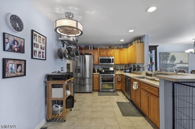 5 Caleb Ct, Hardyston Twp, NJ 07419 - kitchen with stainless steel appliances, a sink, a peninsula, light countertops, and recessed lighting