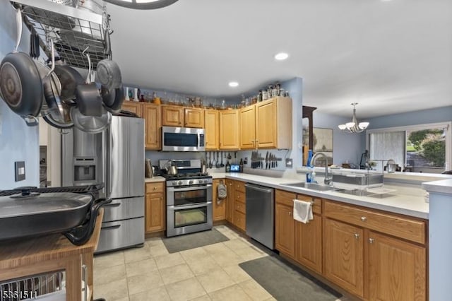 5 Caleb Ct, Hardyston Twp, NJ 07419 - kitchen with appliances with stainless steel finishes, a chandelier, light countertops, a sink, and a peninsula