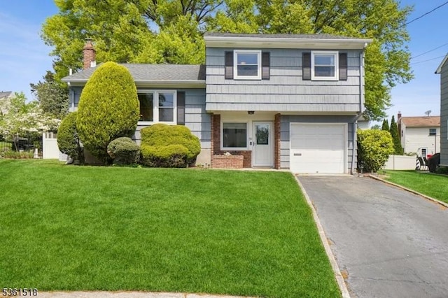 59 Eaton Pl, Bloomfield Twp, NJ 07003 - split level home featuring driveway, a front lawn, a garage, and a chimney