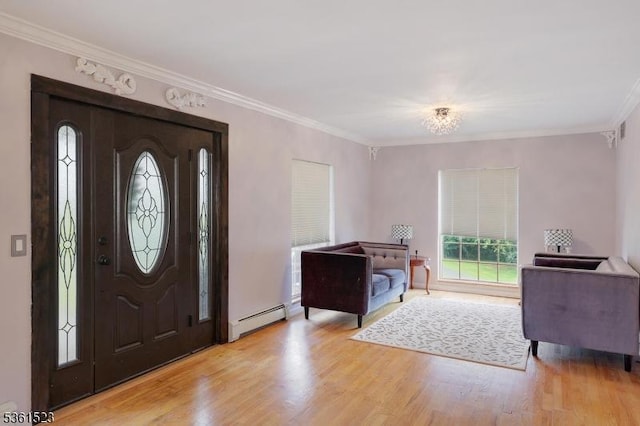 933 River Rd, Hillsborough Twp, NJ 08844 - entrance foyer featuring a baseboard radiator, light wood finished floors, crown molding, and baseboards