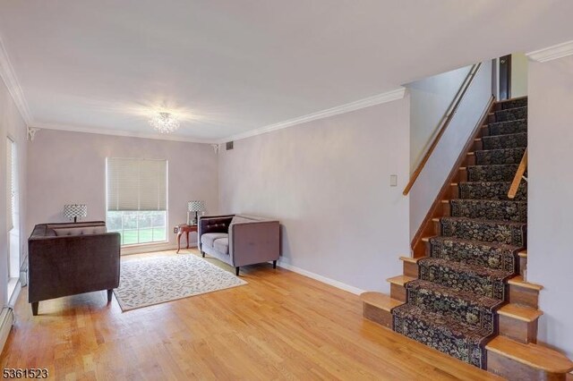933 River Rd, Hillsborough Twp, NJ 08844 - living area with stairs, ornamental molding, wood finished floors, and baseboards