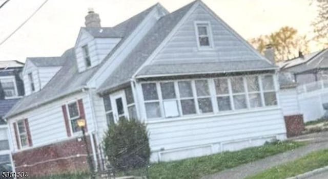 54 Clauss St, Carteret Boro, NJ 07008 - view of side of property with a chimney