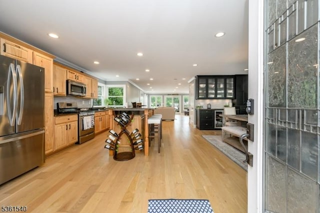 307 Squaw Trl, Hopatcong Boro, NJ 07821 - kitchen with appliances with stainless steel finishes, backsplash, light wood-style floors, recessed lighting, and dark countertops