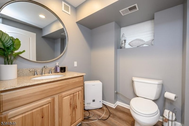 307 Squaw Trl, Hopatcong Boro, NJ 07821 - bathroom with toilet, wood finished floors, vanity, and baseboards